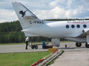 Bags are unloaded directly onto the tarmac in Fort Chipewyan. 