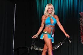 Yet another category: the fitness diva model. Can anyone please explain what wearing different costumes has to do with fitness? 